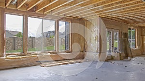 Panorama Unfinished house interior with air conditioning ducts and glass windows and door