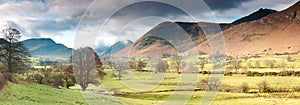 Panorama of valley and mountains of lake district with moody skies