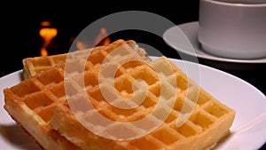 Panorama of Viennese waffles lying next to a coffee cup