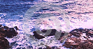 panorama view from above where the sea waves crashes on the rocky coast under a sunset sky, concept of holiday, Porto Cesario