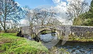 A panorama view across River Syfynwy, Wales towards the Gelli bridge photo