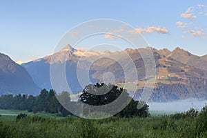 Panorama view with alpine mountains and blue sky in Salzburgerland, Austria