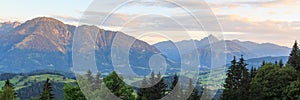 Panorama view with alpine mountains and blue sky in Salzburgerland, Austria