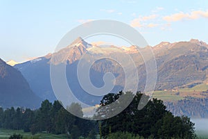 Panorama view with alpine mountains and blue sky in Salzburgerland, Austria