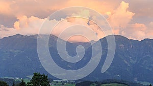 Panorama view with alpine mountains during twilight with alpenglow in Salzburgerland, Austria