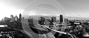 Panorama view of Atlanta skyline and highway in black and white.