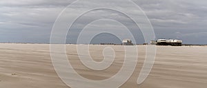 Panorama view of beachfront buildings on stilts on the Wadden Sea coast of northwest Germany