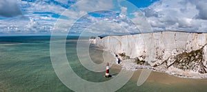 Panorama view of the Beachy Head Lighthouse in the English Channel and the white cliffs of the Jurassic Coast