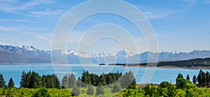 Panorama view of Beautiful scene of Mt Cook in summer beside the lake with green tree and blue sky. New Zealand I