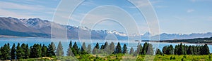 Panorama view of Beautiful scene of Mt Cook in summer beside the lake with green tree and blue sky. New Zealand I