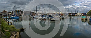 A panorama view of boats moored on the River Test at Eling near Southampton, UK