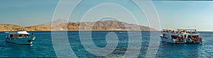 A panorama view of boats moored of Tiran island near Sharm El Sheik, Egypt