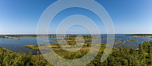 Panorama view of the coastal islands of the Kvarken Archipelago under a blue sky