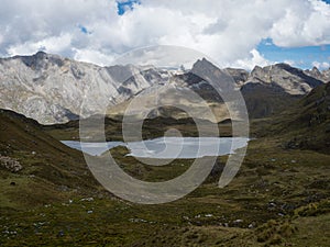 Panorama view of Cordillera Huayhuash Circuit andes alpine mountain lake Laguna Carnicero Ancash Peru South America photo