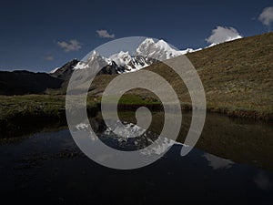 Panorama view of Cordillera Huayhuash Circuit andes alpine mountain lake Laguna reflection Ancash Peru South America