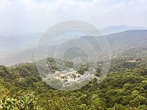 Panorama view of Doi Puiâ€™s Hmong ethnic hill-tribe village, aerial view green forest on the mountain background. Doi Pui Hmong