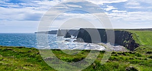 Panorama view of the Duncansby Sea Stacks and wild and rugged coastline of Caithness in the Scottish Highlands