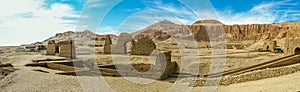 A panorama view on the east bank of the Nile at Luxor, Egypt past ancient ruins towards the Hatshepsut temple photo