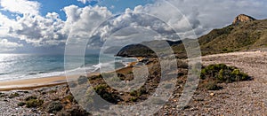 Panorama view of empty beaches and mountainous coast in Murcia under an expressive sky