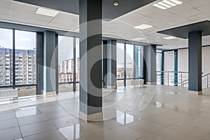 panorama view in empty modern hall with columns, doors , stairs and panoramic windows