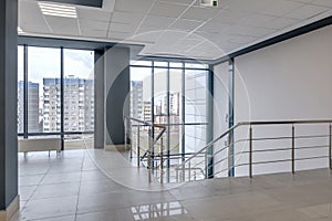 panorama view in empty modern hall with columns, doors , stairs and panoramic windows