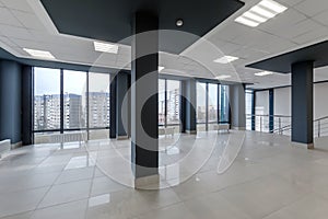 panorama view in empty modern hall with columns, doors , stairs and panoramic windows