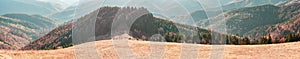 Panorama View from high mountain on picturesque landscape autumn Carpathian. Dramatic sky. Ukraine, Europe. Majestic sunset in