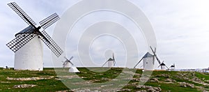 Panorama view of the historic white windmills of La Mancha above the town of Campo de Criptana