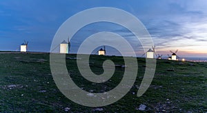 Panorama view of the historic white windmills of La Mancha above the town of Campo de Criptana