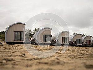 Panorama view of holiday homes beach houses on sand beach Breezand Vrouwenpolder Veere Zeeland Netherlands North Sea