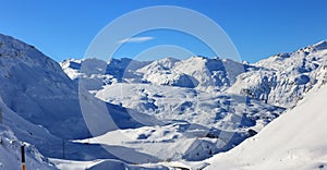 Panorama view of the Julier Pass valley with snow covered Swiss Alps photo