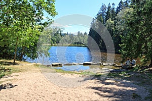 Panorama view of lake Karchesweiher surrounded by trees in Fichtel Mountains, Germany photo
