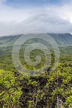 A panorama view of lava fields on the side of the Arenal volcano in Costa Rica