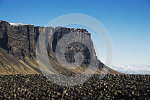 Panorama view of Lomagnupur table mountain subglacial mound rock formation ridge edge vertical cliff South Iceland