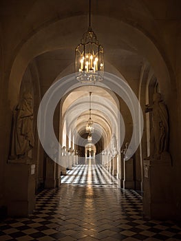 Panorama view of long hallway corridor indoor interior architecture of Versailles Castle Palace in Yvelines Paris France