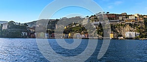 A panorama view looking towards the shore past the harbour wall of the marina Piccola, Sorrento, Italy in the early morning