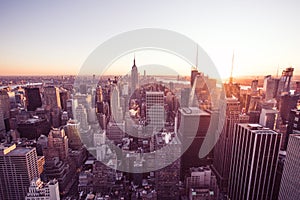 Panorama view of Midtown Manhattan skyline with the Empire State Building from the Rockefeller Center Observation Deck. Top of the