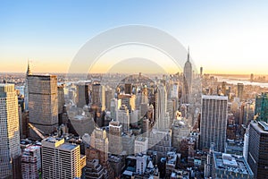 Panorama view of Midtown Manhattan skyline with the Empire State Building from the Rockefeller Center Observation Deck. Top of the