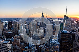 Panorama view of Midtown Manhattan skyline with the Empire State Building from the Rockefeller Center Observation Deck. Top of the