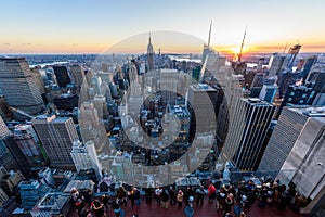 Panorama view of Midtown Manhattan skyline with the Empire State Building from the Rockefeller Center Observation Deck. Top of the