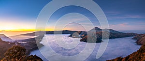 Panorama view of Mount Bromo volcano at sunrise in East Java, Indonesia surrounded by morning fog