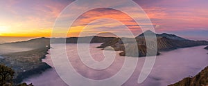 Panorama view of Mount Bromo volcano at sunrise in East Java, Indonesia surrounded by morning fog