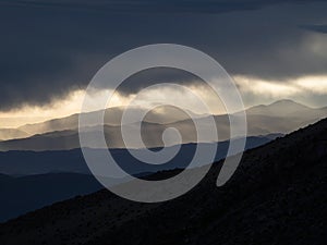 Panorama view of mountain range silhouette layers haze dust fog clouds at Misti volcano Arequipa Peru Andes