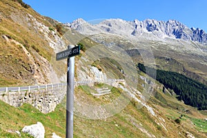 Panorama view of mountains and Furka Pass road at James Bond street where a scene for the movie Goldfinger was shot in the Swiss photo