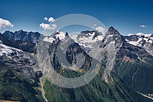 Panorama view of mountains snowy peaks cloudy sky