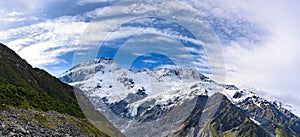 Panorama view the mueller glacier at kea point in Mount Cook National Park, the rocky mountains and green grasses