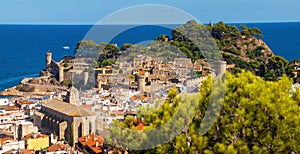 Panorama view of the old town of Tossa de mar, city on the Costa Brava. Buildings and castle on the hill. Amazing city in