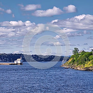 Panorama view over a small bay with summer houses and jetties in Stockholm, Sweden.