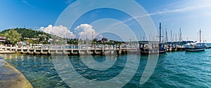 A panorama view past boats moored on a jetty at Portoroz, Slovenia