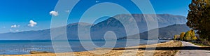 Panorama view of Pogradec Beach and mountains on the southern shores of Lake Ohrid in Albania